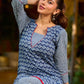 chic indigo short kurta featuring a floral stripe fusion and vibrant red piping.