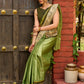 Pastel green semi-silk saree featuring Madhubani artwork on pallu and border
