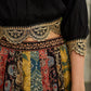 Modern colourful Ajrakh lehenga beautifully contrasted by a sleek black gathered topwear.