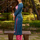 Graceful teal kurta with delicate pink lotus printing, subtle pink accents, and a statement patch above the neckline.