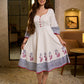Blooming White Flared Cotton Dress with Placement Block Print Florals & Indigo Geometric Hem & Cuff Band