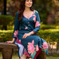 Graceful teal kurta with delicate pink lotus printing, subtle pink accents, and a statement patch above the neckline.