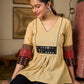 Chic Beige Cotton Top Enhanced With Ajrakh Print Sleeves And An Embellished Mirror Work Yoke