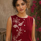 Charming red hand block print top showcasing elegant floral motifs, a contemporary pleated silhouette, and refined detailing, blending artisanal craftsmanship with effortless everyday style.