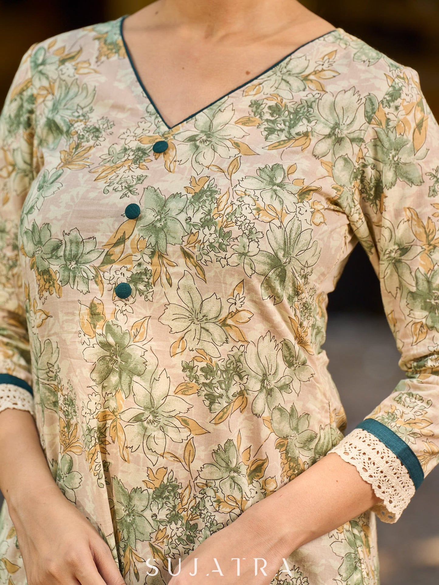 Soft cream delicate floral a line kurta with refined bottle green accents