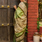 Pastel green semi-silk saree featuring Madhubani artwork on pallu and border