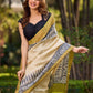 Off-White Handwoven Pure Tussar Silk Block Printed Saree with Traditional Green and Gold Zari Detailing
