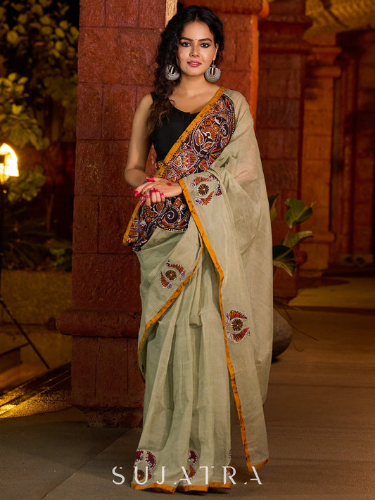 Classic olive Chanderi saree enhanced with heritage batik appliqué