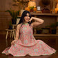 Soft peachy pink floral halter-neck dress with fresh green accents, crafted in a bias-cut silhouette that creates graceful flow and a fluid drape for an effortless summer look.