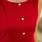 Vibrant red sleeveless dress with a bold off-white floral hand block print at the hem and clean off-white edging for a striking, handcrafted-inspired finish.