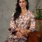 Beige traditional printed dress with rich maroon accents.