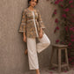 Romantic peach Jaipur floral top adorned with scalloped lace, gathered sleeve hems, and playful tie-knot accents.
