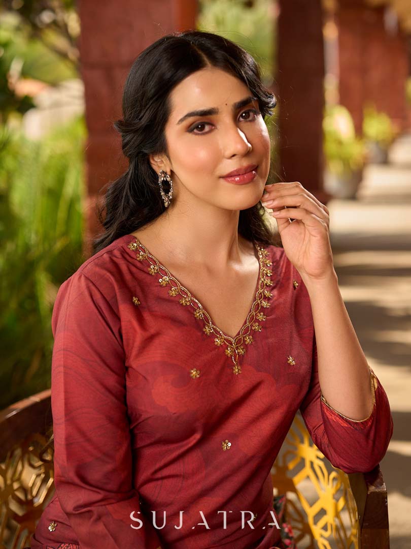 Classic deep rustic maroon kurta with detailed hand embroidery, statement olive and cream Pichwai artwork, and rich gold highlights