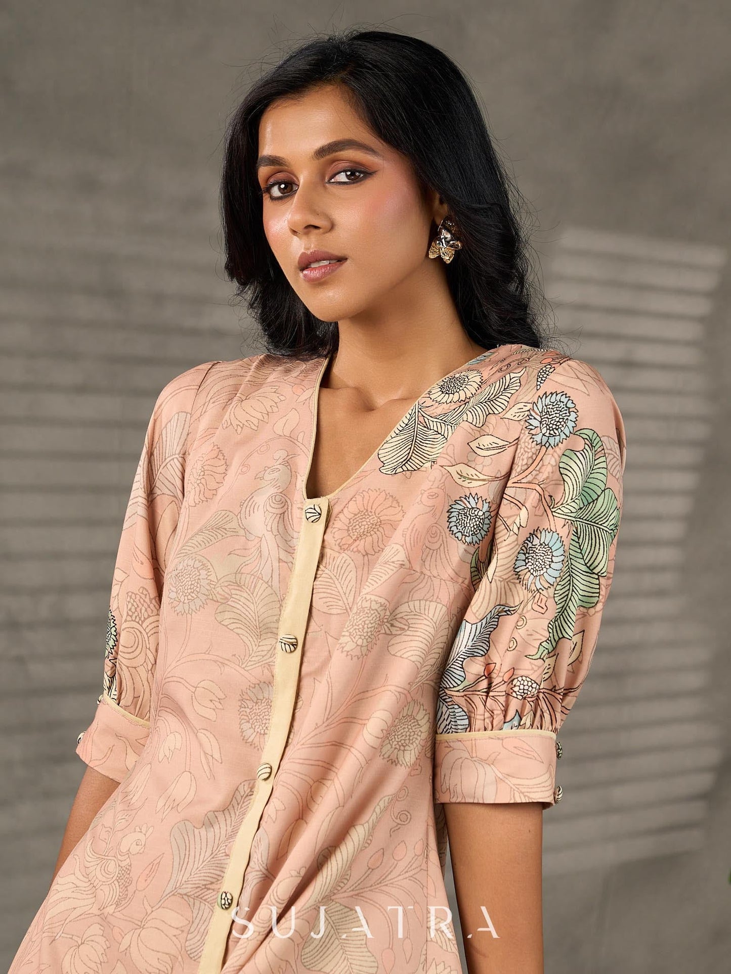 Peach Kalamkari-inspired shirt dress with soft beige accents.