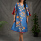 Indigo Kalamkari printed dress with vibrant red and mustard accents.