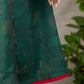 Bottle green Madhubani printed dress with vibrant magenta accents.
