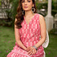 Graceful pink Ikat long dress accented in white, designed with gathered detailing at the fall and a clean sleeveless finish