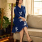 Navy blue apple-cut shirt dress with white floral hand block motifs, conceptually placed and finished with clean white edging and red accents for a refined, contemporary look.