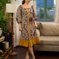 Heritage Kalamkari dress with elegant mustard accents and black pearl embellishments.