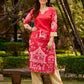 Culturally rooted red kurta displaying classic Warli designs with subtle beige touches