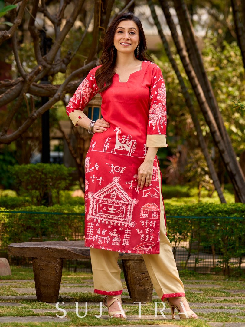 Culturally rooted red kurta displaying classic Warli designs with subtle beige touches