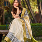 Off-White Handwoven Pure Tussar Silk Block Printed Saree with Traditional Green and Gold Zari Detailing