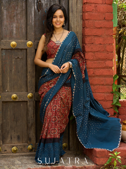 Fusion of Ajrakh charm and Bandhej flair. Rust & Teal cotton Saree