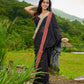 Classic black cotton saree featuring intricate weave and radiant zari edges