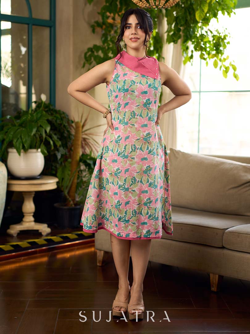 Summer pink floral sleeveless dress featuring an asymmetrical cowl collar and delicate pearl accents, creating a soft, fluid silhouette with a touch of elegant, contemporary charm.