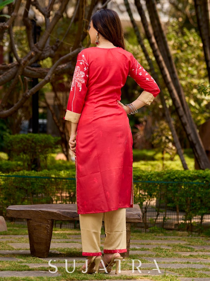 Culturally rooted red kurta displaying classic Warli designs with subtle beige touches