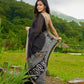 Classic black cotton saree featuring intricate weave and radiant zari edges