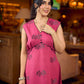 Rich wine drop-shoulder dress with black and grey hand block printed floral motifs, a softly gathered yoke, black pearl embellishments, and bold black accents for a striking artisanal look.