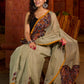 Classic olive Chanderi saree enhanced with heritage batik appliqué