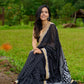 Classic black cotton saree featuring intricate weave and radiant zari edges