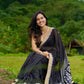 Classic black cotton saree featuring intricate weave and radiant zari edges