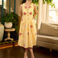 Yellow and white zebra-striped hand block printed sleeveless vintage luxe dress with maroon bird motifs and matching accents for a bold, elegant statement look.