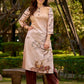 Artisanal cream kurta adorned with Gond-inspired motifs and classic brown accents