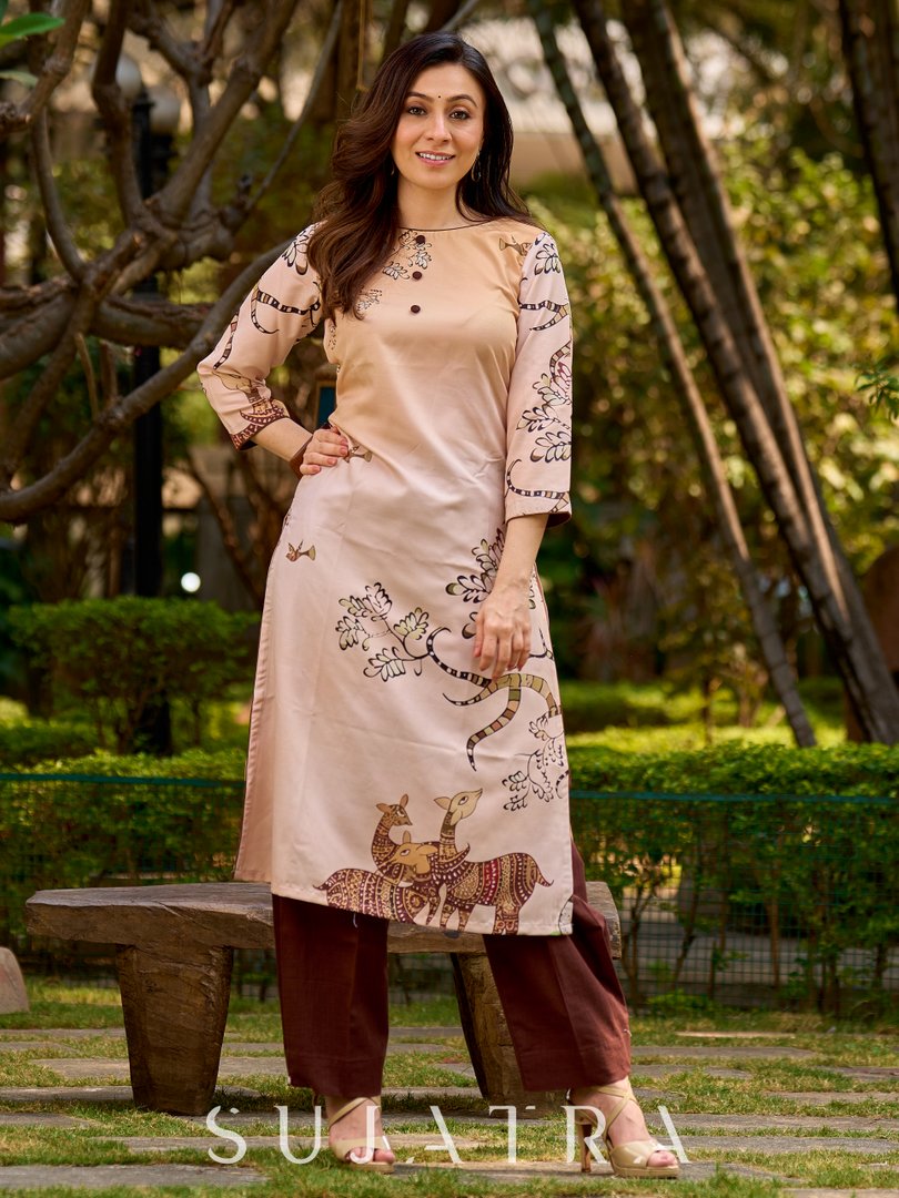 Artisanal cream kurta adorned with Gond-inspired motifs and classic brown accents