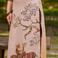 Artisanal cream kurta adorned with Gond-inspired motifs and classic brown accents