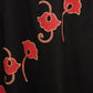 Stunning black rayon dress adorned with vibrant floral block print accents
