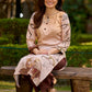 Artisanal cream kurta adorned with Gond-inspired motifs and classic brown accents