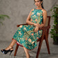 Green peacock motif printed dress with straight neckline and orange accents