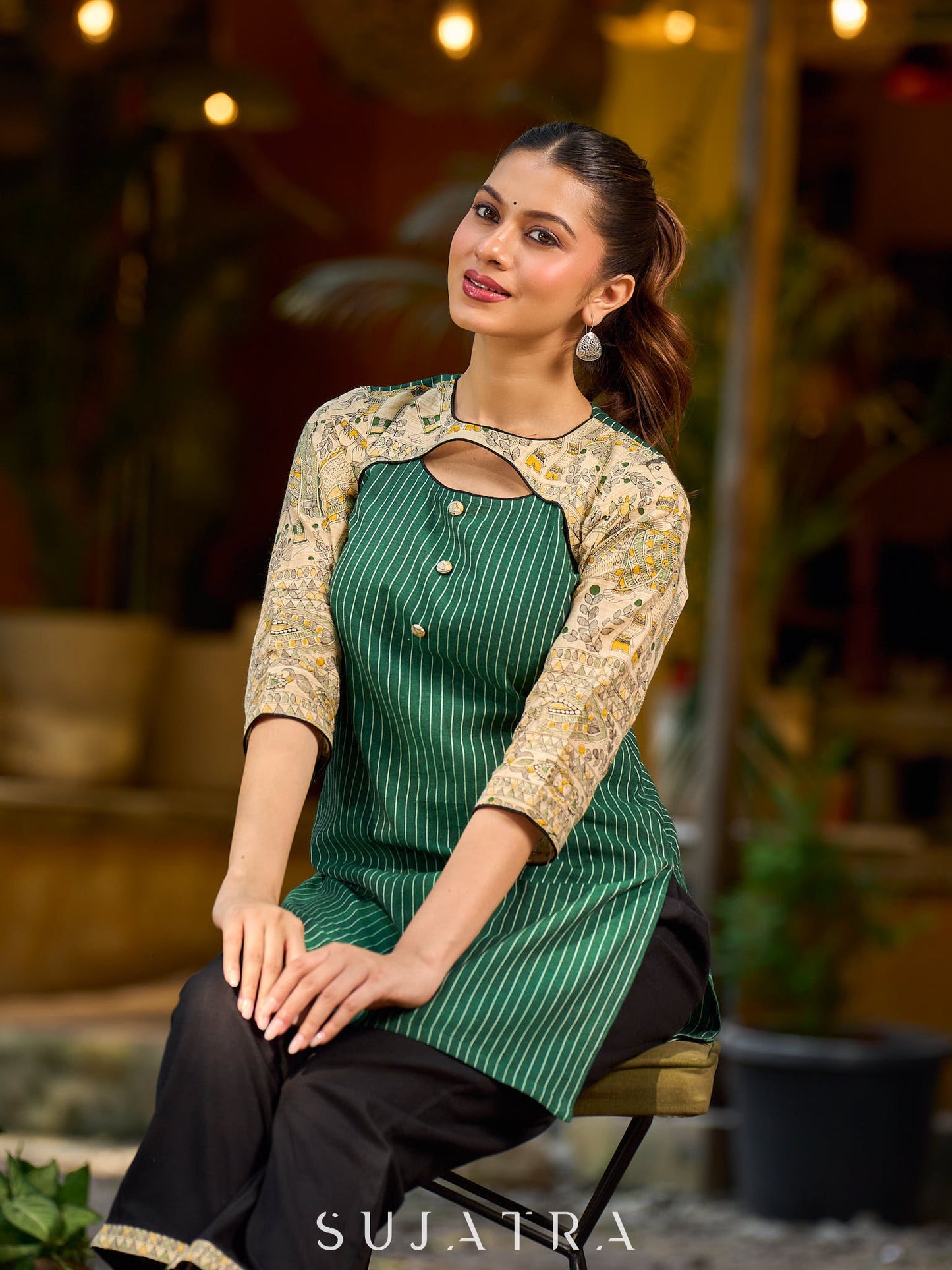 Vibrant green Ikat Madhubani short kurta featuring a stylish cut neckline