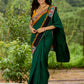 Artisanal cotton saree in bold green with Madhubani hand painted charm