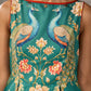 Green peacock motif printed dress with straight neckline and orange accents