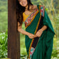 Artisanal cotton saree in bold green with Madhubani hand painted charm