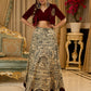 Madhubani print lehenga with a scalloped hem, paired with a rich maroon velvet blouse - Short Jacket with elegant brooch style embroidery Optional