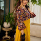 Mustard Kalamkari dress with an asymmetrical yoke and puffed sleeves.