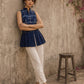 Contemporary indigo top with delicate dragonfly motifs, high folded collar, and graceful pleated hemline.