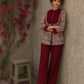 Elegant maroon floral top with intricate maroon pleats, high neckline, covered buttons, and coordinating sleeve cuffs.